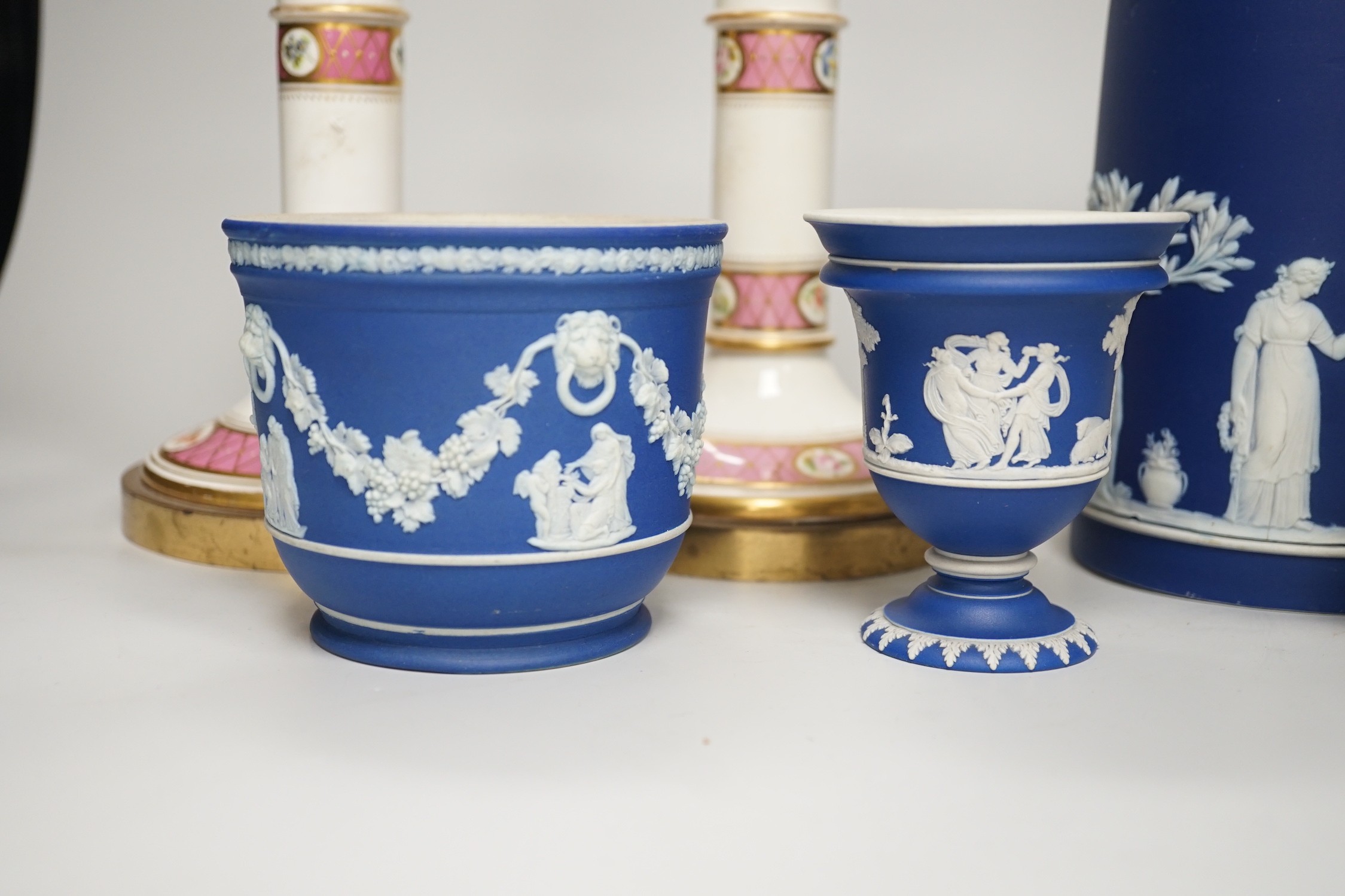 Three mid to late 19th century pieces of Wedgwood Jasperware, including a coffee pot and a small cache-pot, a pair of 19th century porcelain candlesticks converted into lamps